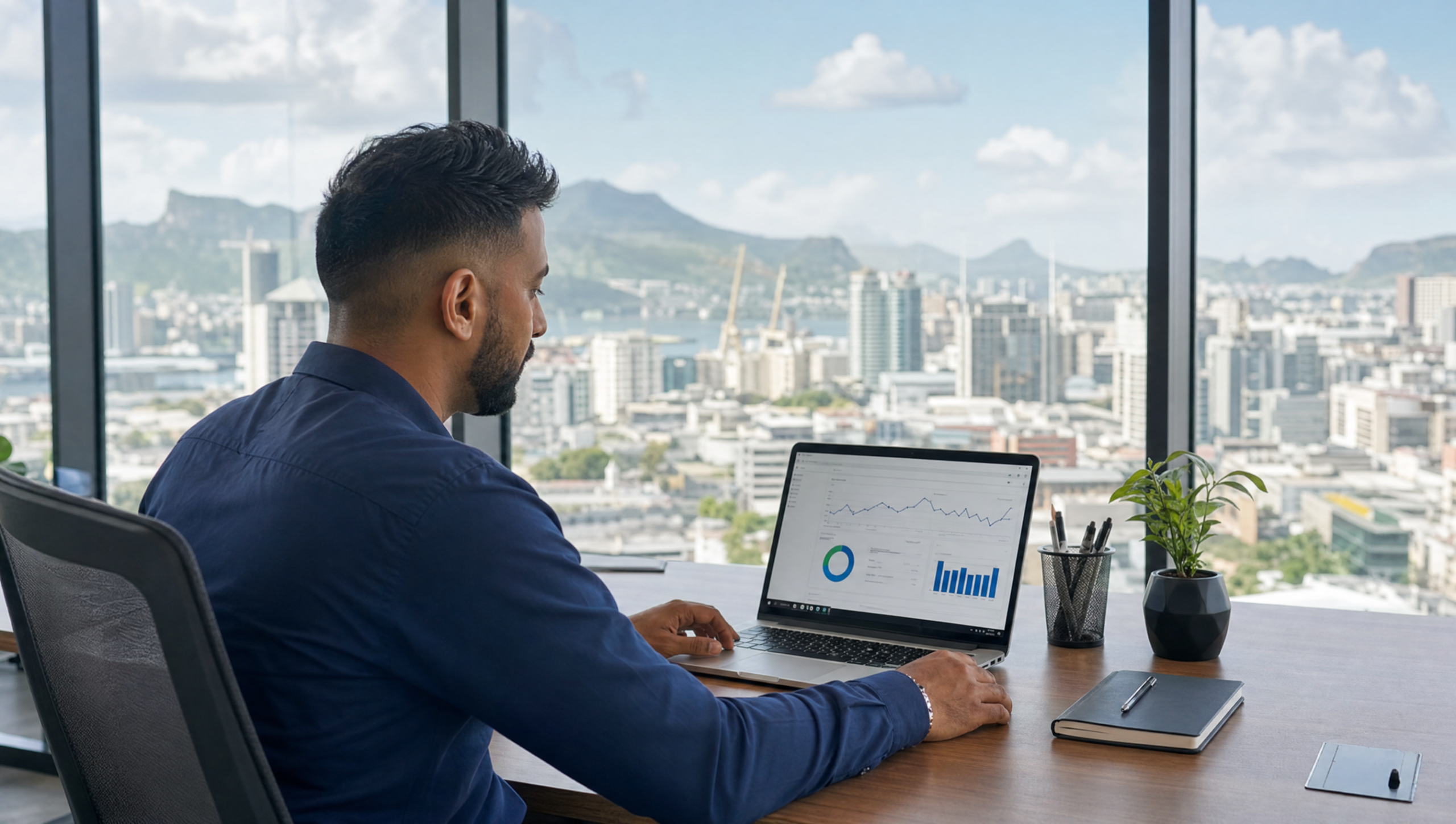 Mauritian professional reviewing SEO analytics data on laptop